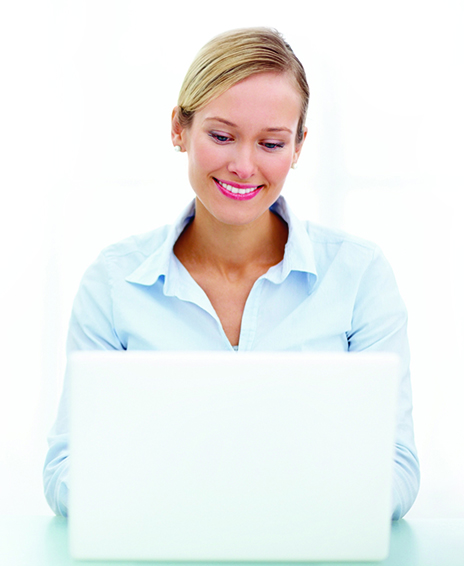 Businesswoman using a laptop and smiling